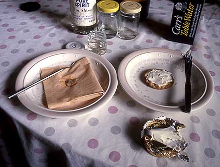 Colour photo of a table with cooking supplies and utensils